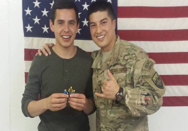 Can someone tell me what D's holding?? LOL